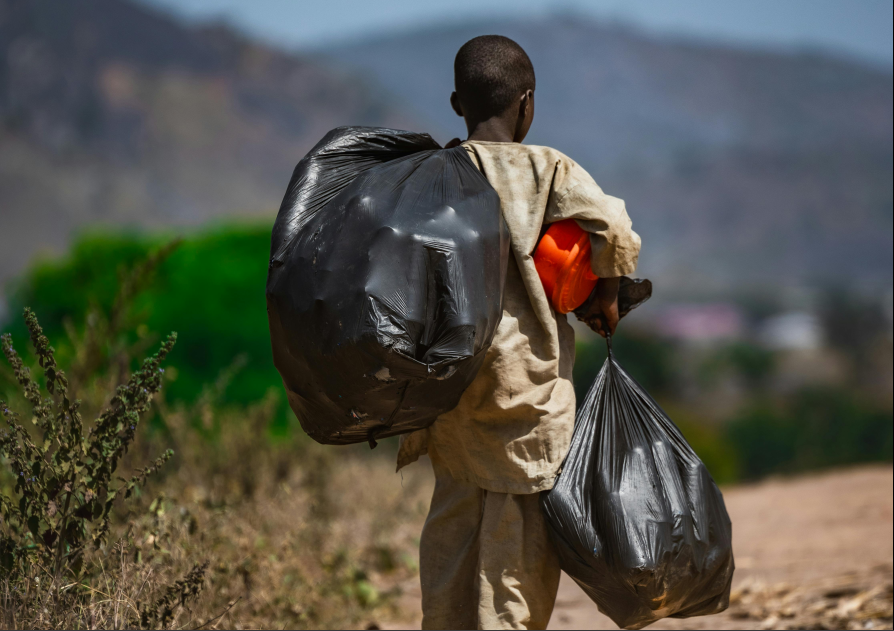 Children walking with containers, symbolizing daily life and potential